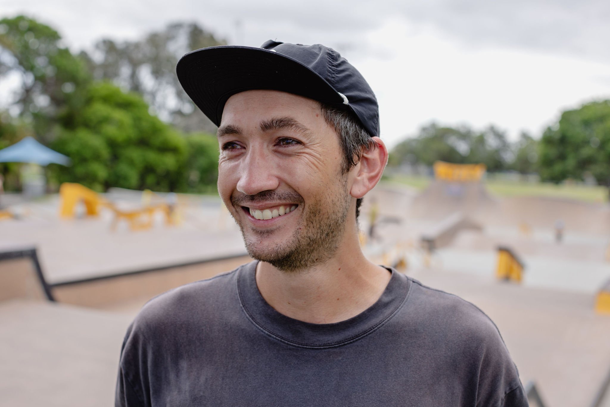 Theo smiling at Pizzey Park skatepark